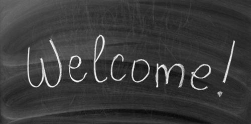 Welcome icon written in chalk on blackboard 